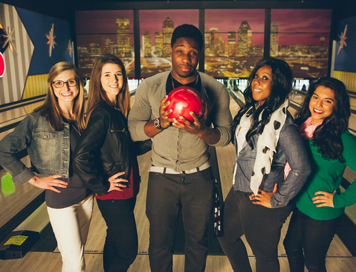 Group of people with a bowling ball